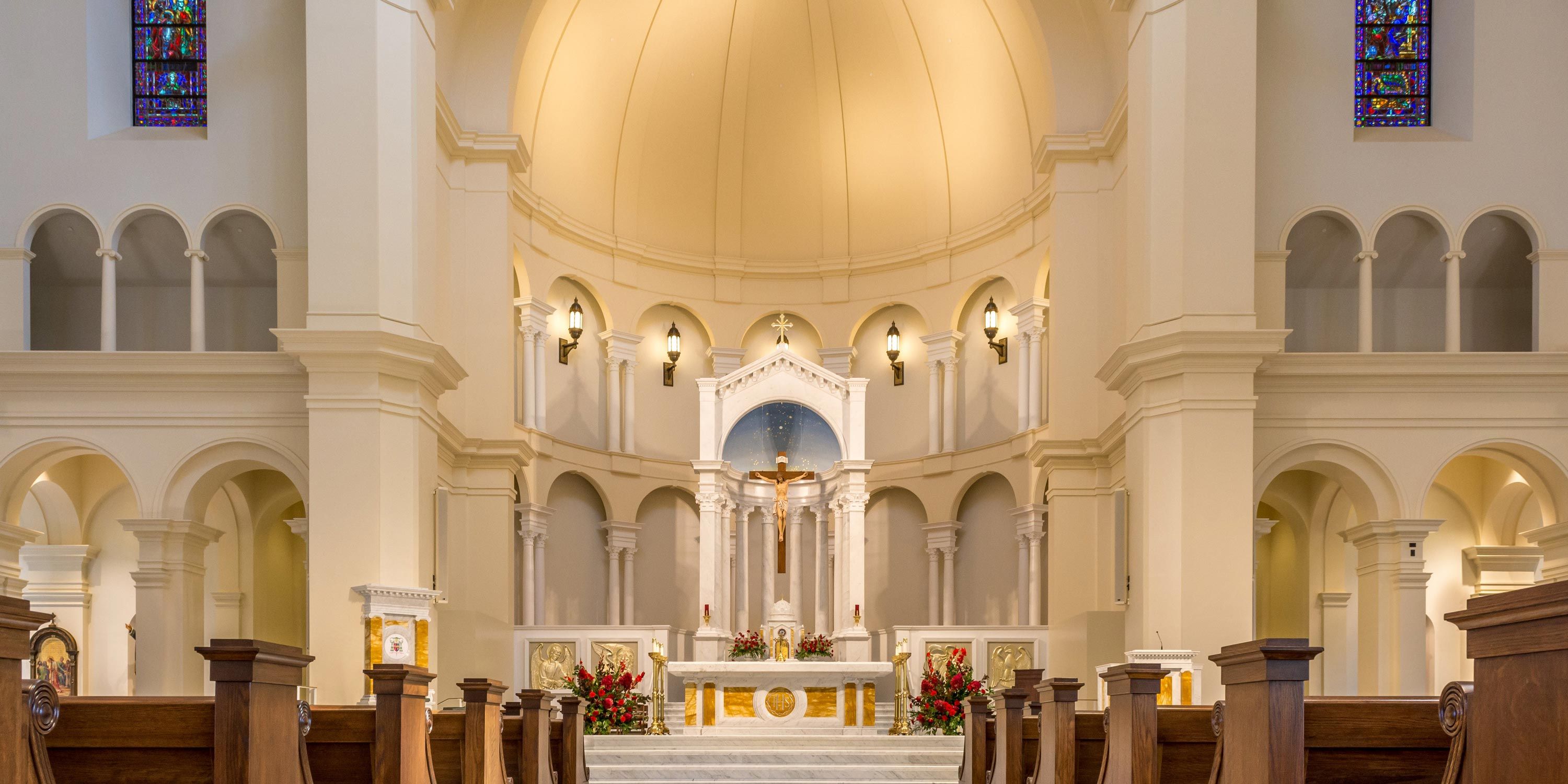 wide open church with traditional design and wooden pews