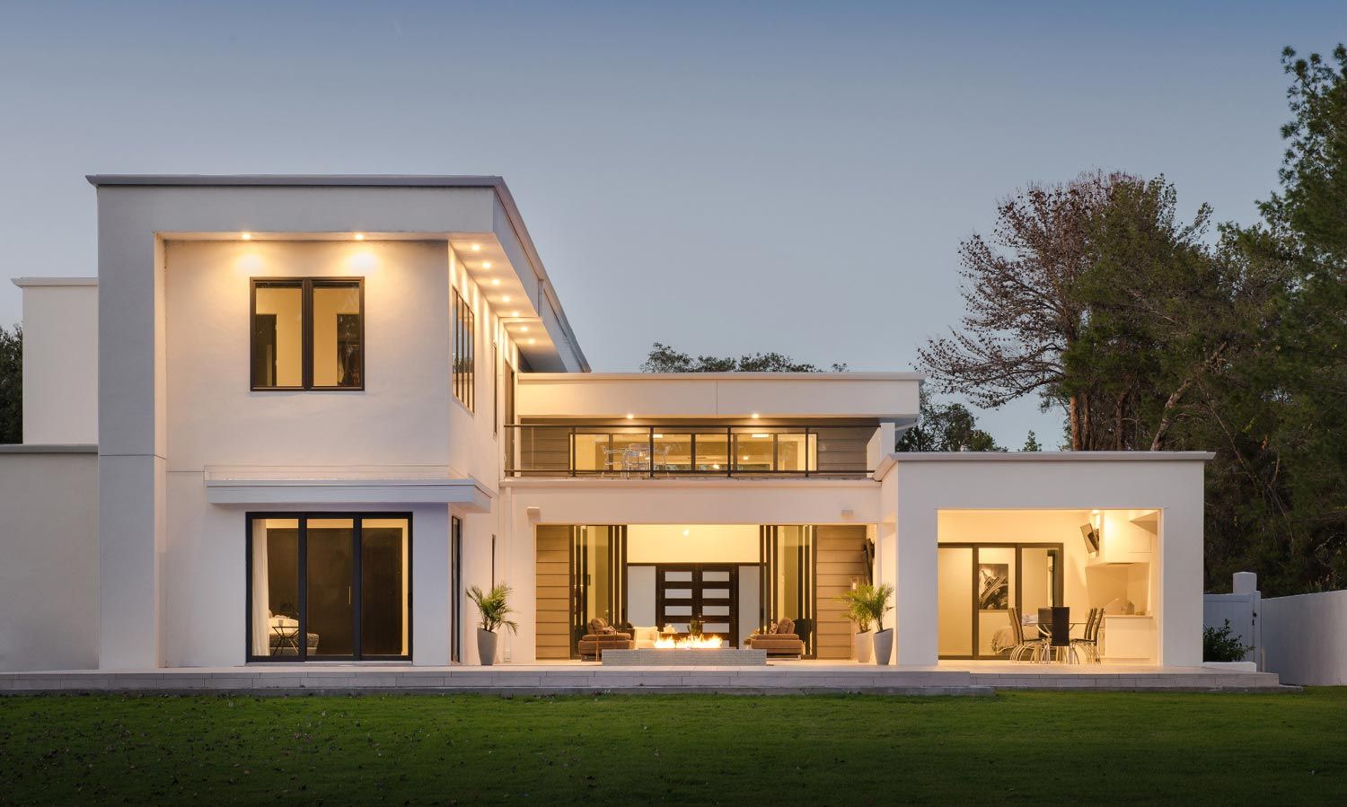 modern home with lutron lighting at dusk