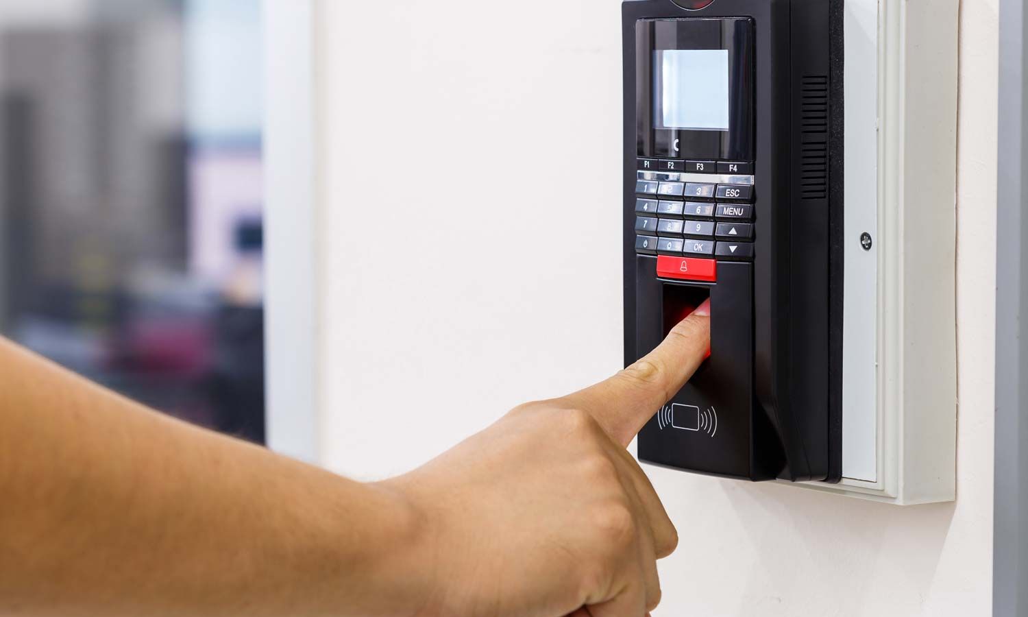 a person using biometrics to enter a room