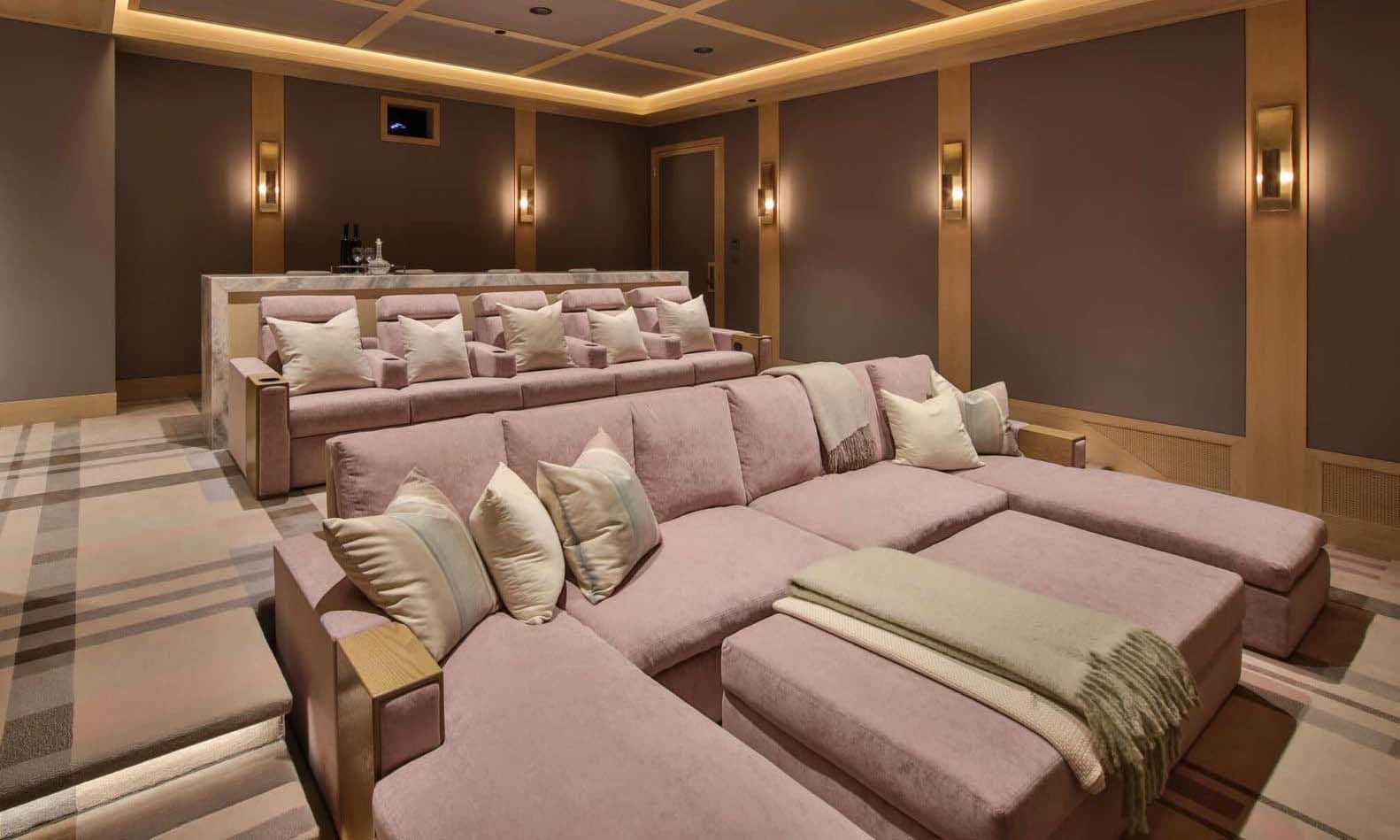 pink toned fortress seating couches in a modern and clean home theater