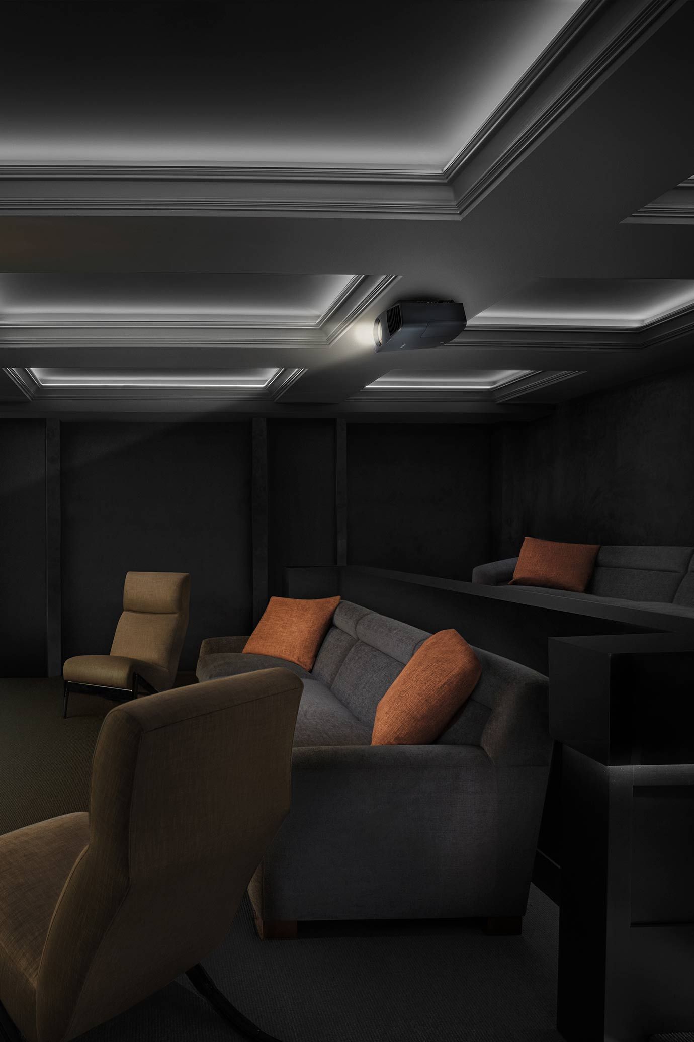 Sony theater with dark couch, orange pillows, and LED recessed lighting in the ceilings