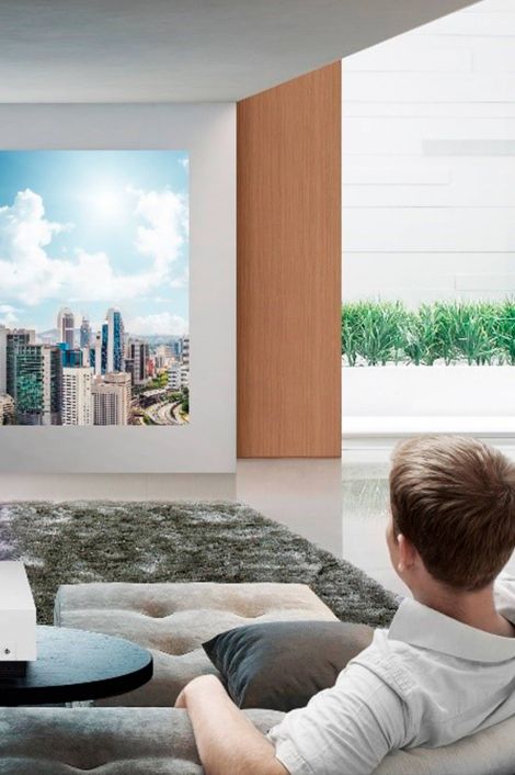 A man watches his samsung tv in his modern home